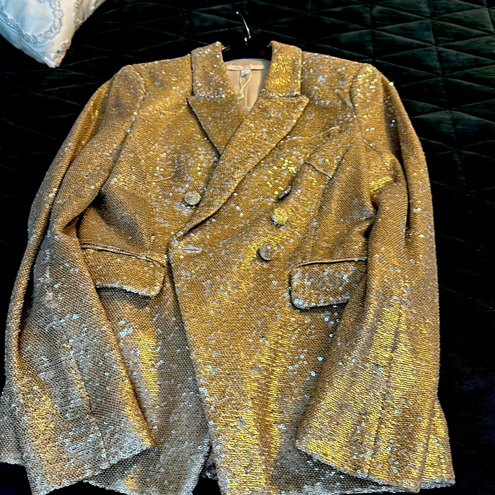 This is a beautiful double breast all sequence, front and back size 4 jacket